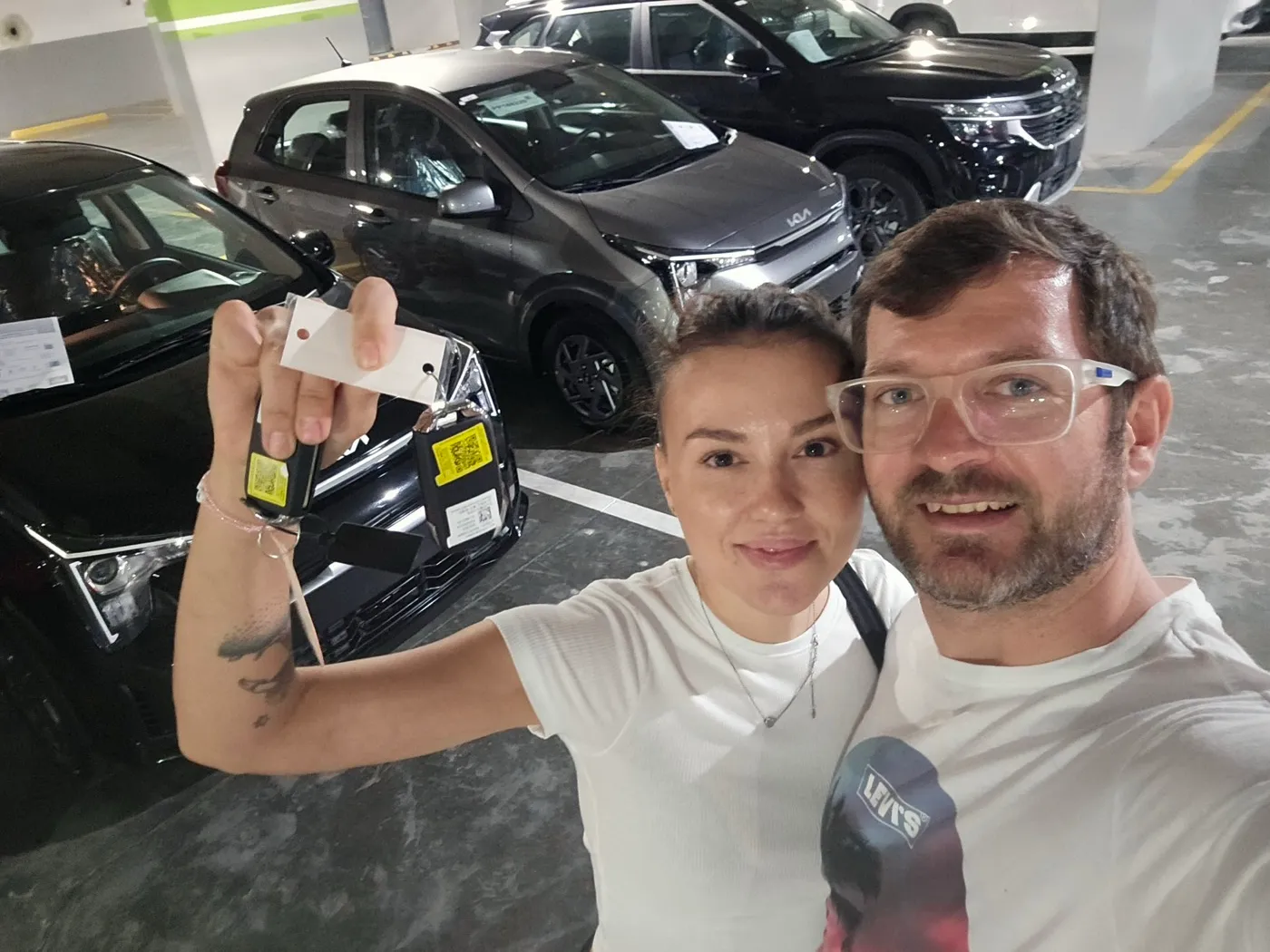 Alexander Karpetsky, Founder and CEO of VROOM.DO, and Karyna Koval, Co-Founder and Marketing Director, photographed with the original VROOM.DO fleet of five vehicles at their Punta Cana location in February 2024.